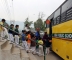 Children boarding the bus after the Cross Country Race