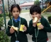 Children relishing refreshment after tiresome race